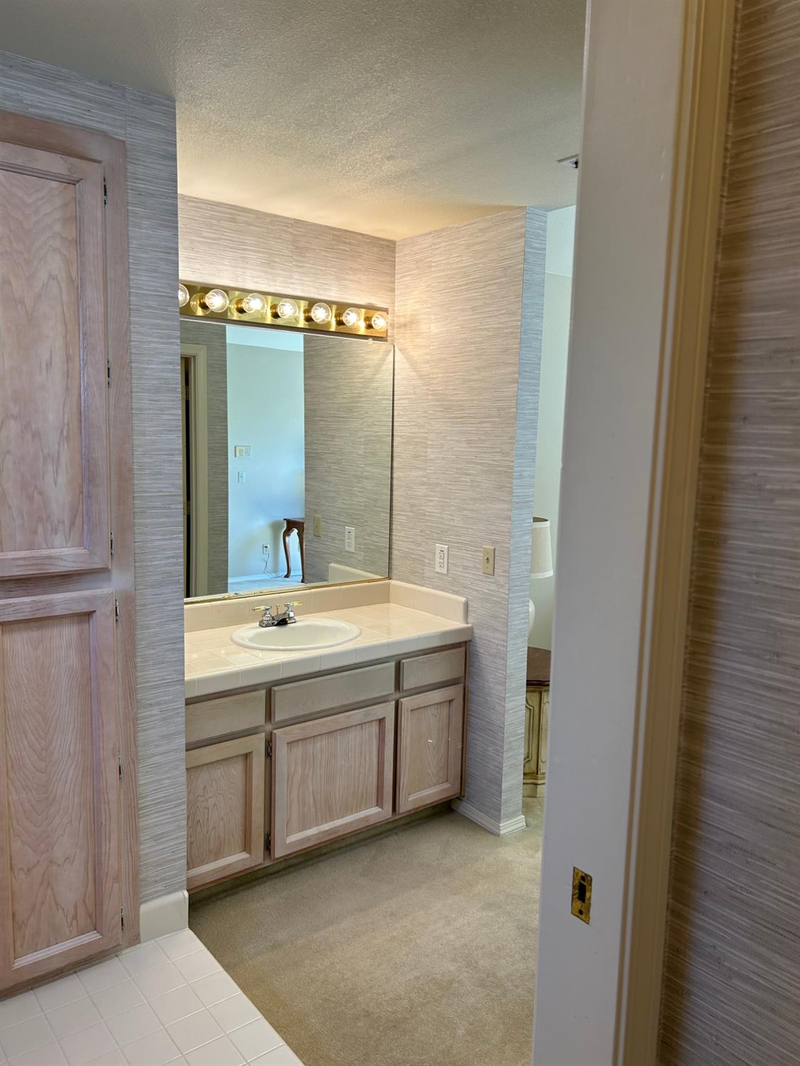 1067 Rio Cidade Way Sacramento, CA 95831 - Photo 24 of 33 a bathroom with a granite countertop sink mirror and bathtub