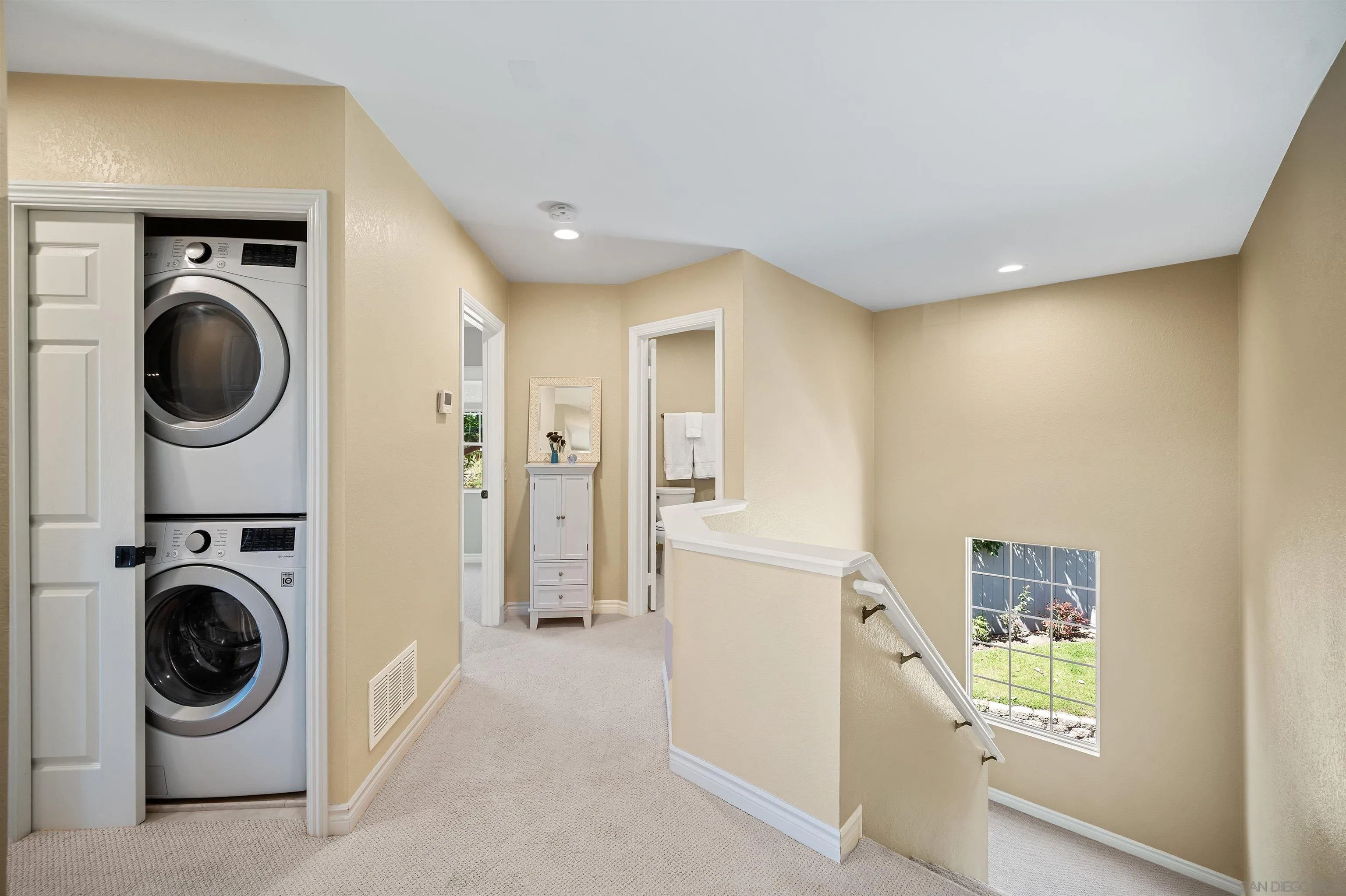 822 Ida Avenue Solana Beach, CA 92075 - Photo 23 of 34 a view of a hallway with washer and dryer