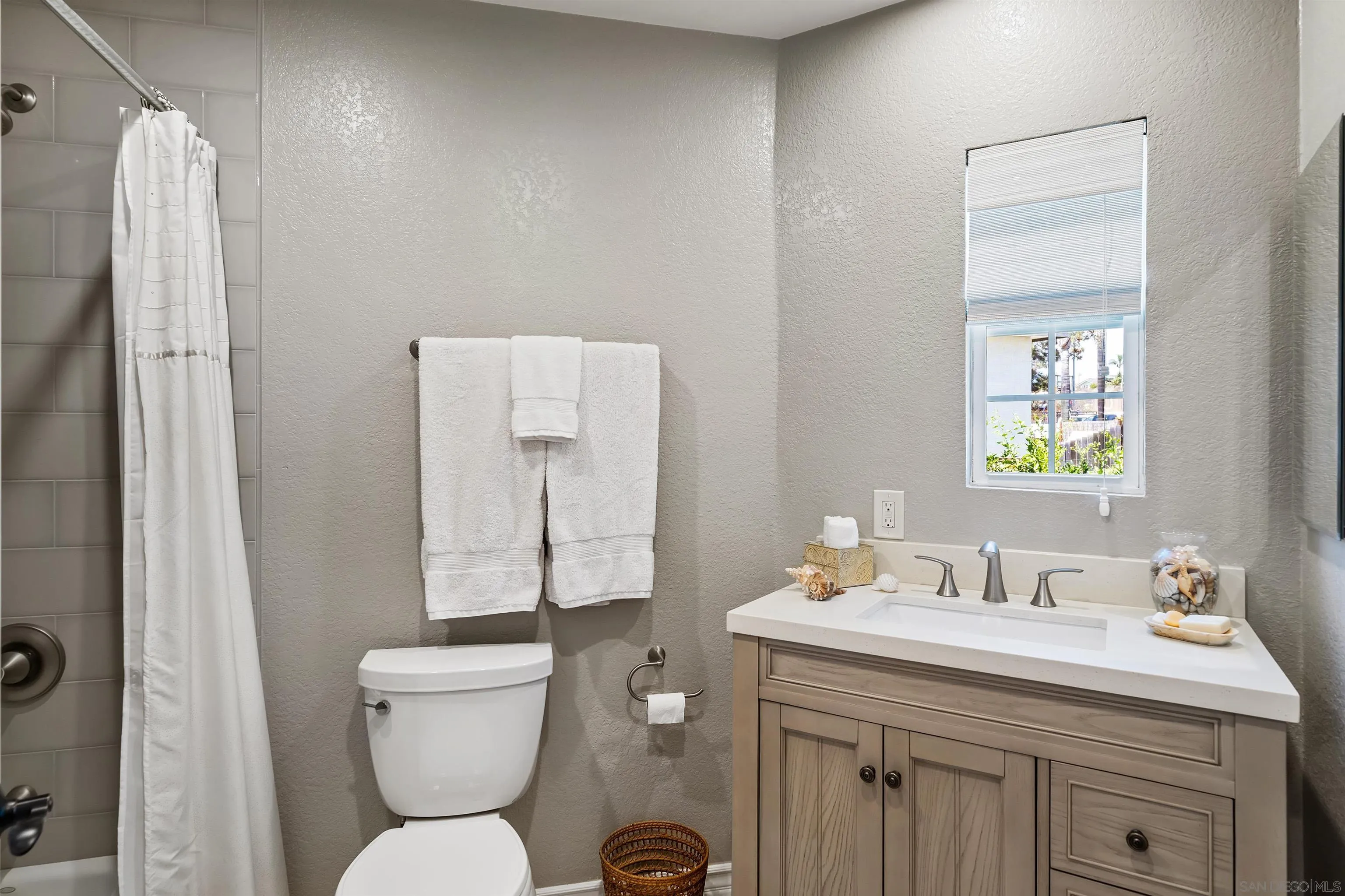 822 Ida Avenue Solana Beach, CA 92075 - Photo 24 of 34 a bathroom with a toilet sink and mirror