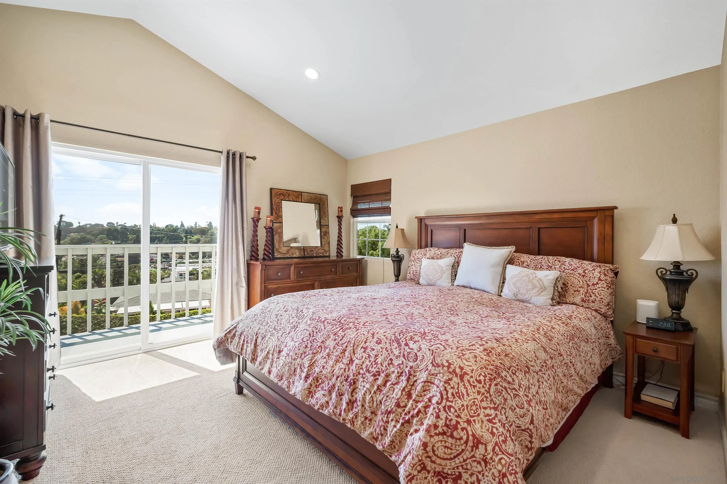822 Ida Avenue Solana Beach, CA 92075 - Photo 28 of 34 a bedroom with a large bed and a large window