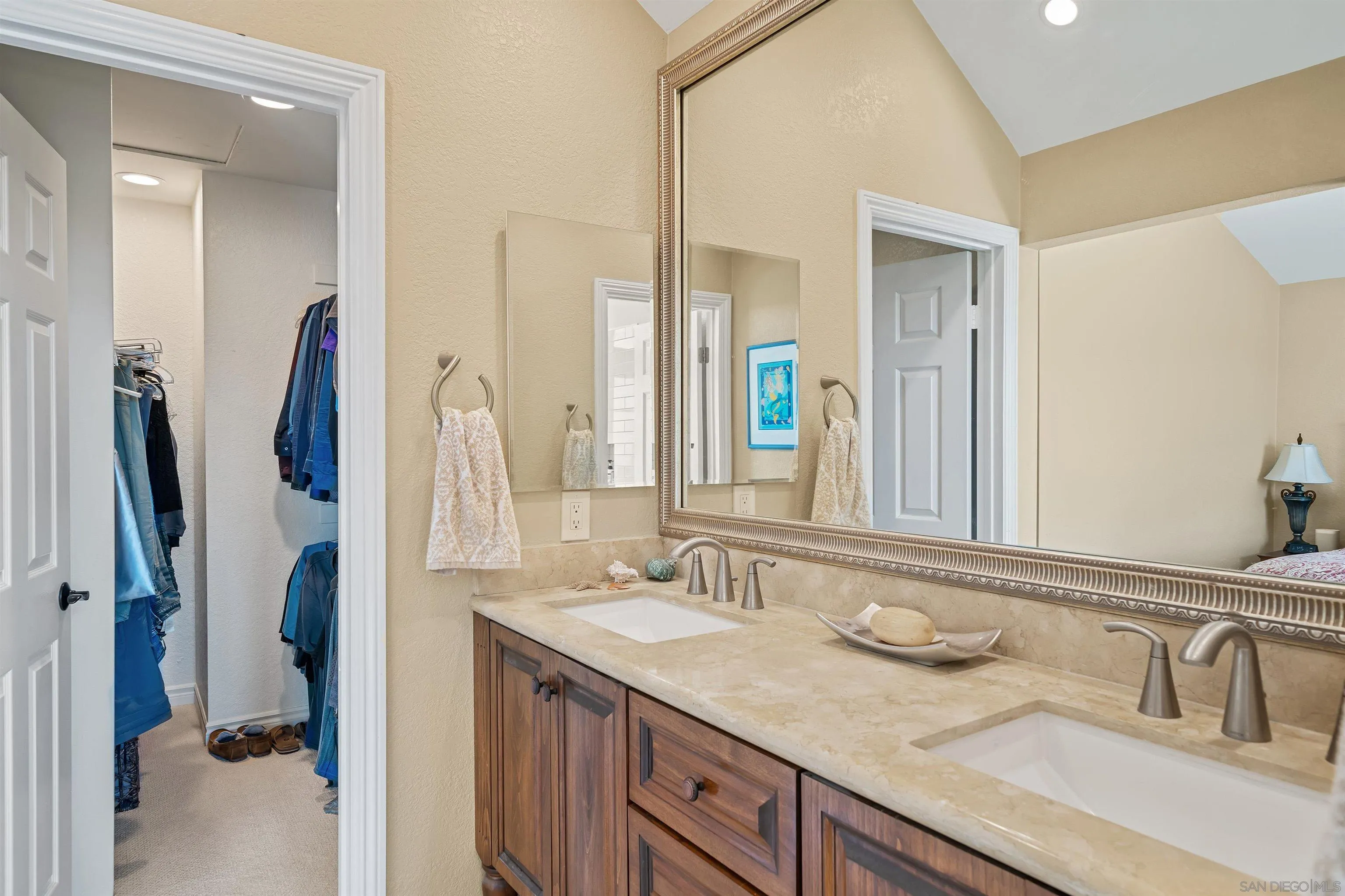 822 Ida Avenue Solana Beach, CA 92075 - Photo 29 of 34 a bathroom with a sink vanity granite and a mirror