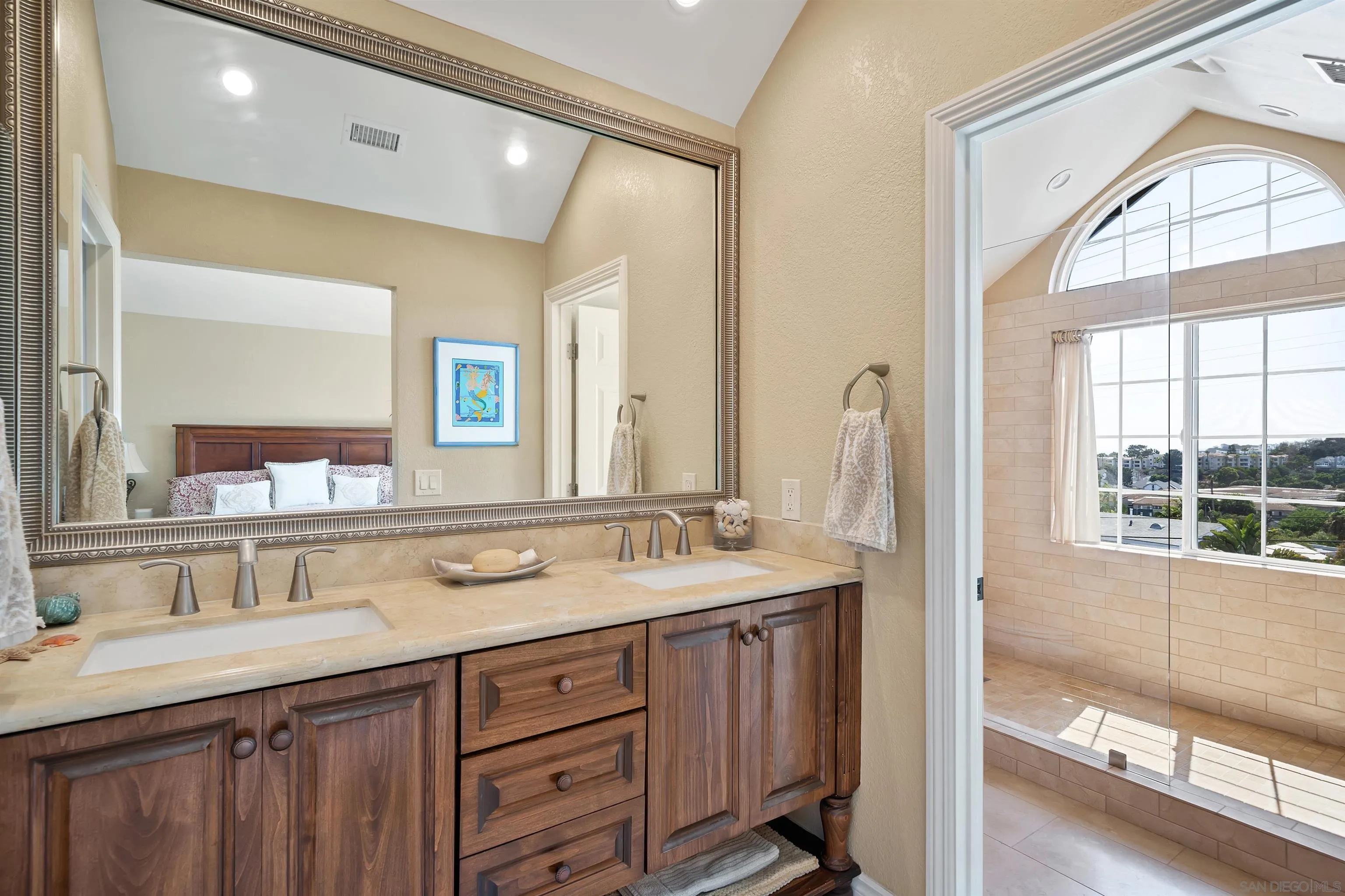 822 Ida Avenue Solana Beach, CA 92075 - Photo 30 of 34 a bathroom with a double vanity sink and a mirror