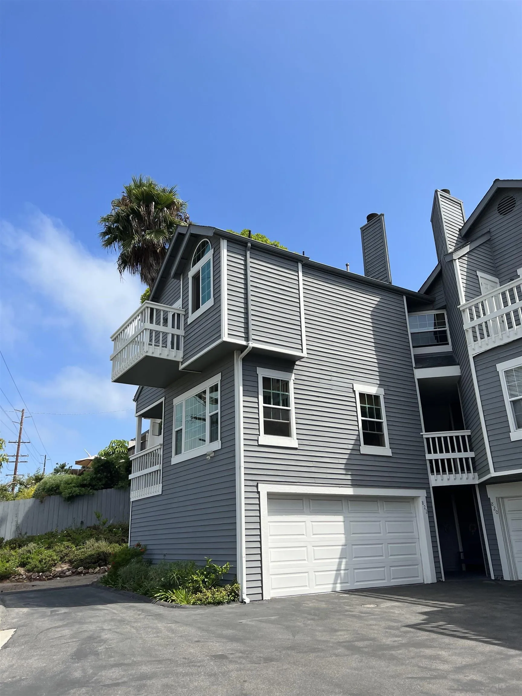 822 Ida Avenue Solana Beach, CA 92075 - Photo 3 of 34 a front view of a house with a garage
