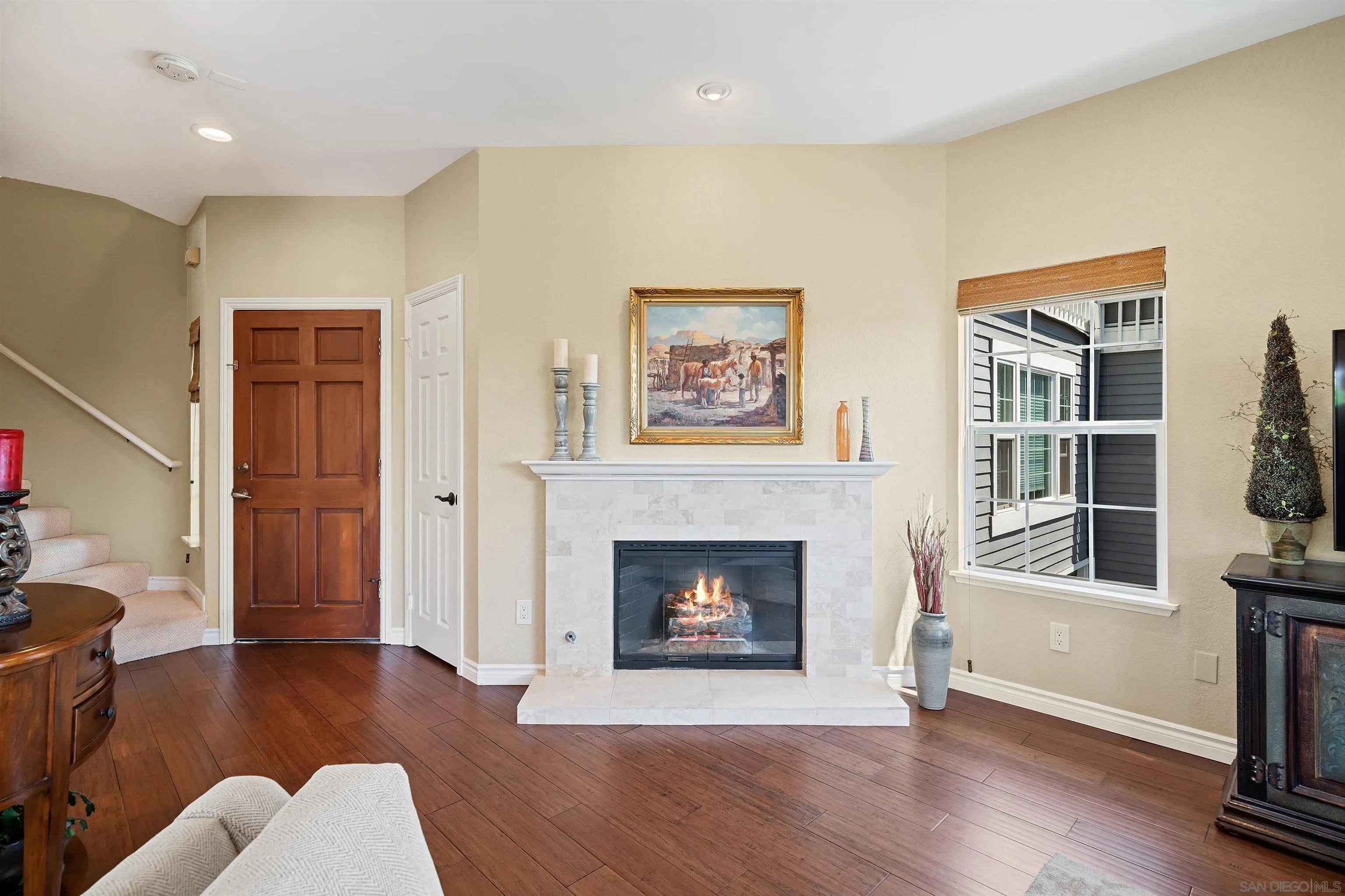 822 Ida Avenue Solana Beach, CA 92075 - Photo 8 of 34 a living room with furniture and a fireplace