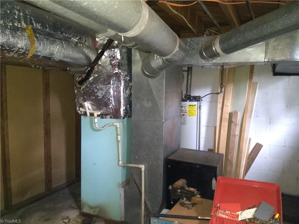 206 Ridgewood Drive Lexington, NC 27292 - Photo 23 of 26 furnace and water heater in basement