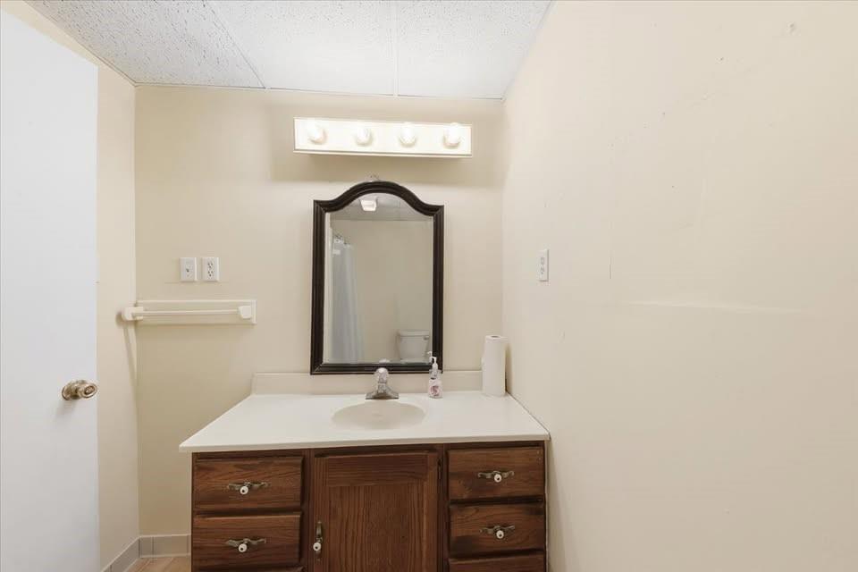 8435 Campbellton Fairburn Road Fairburn, GA 30213 - Photo 19 of 21 a bathroom with a sink and a mirror
