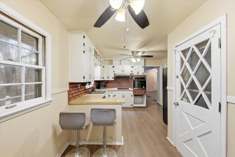 8435 Campbellton Fairburn Road Fairburn, GA 30213 - Photo 2 of 21 a large kitchen with a table chairs refrigerator and cabinets