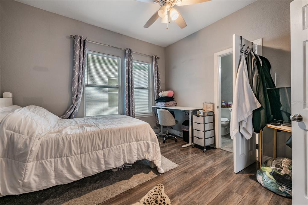 2334 West Spruce Street Tampa, FL 33607 - Photo 14 of 24 a bedroom with a bed and a television