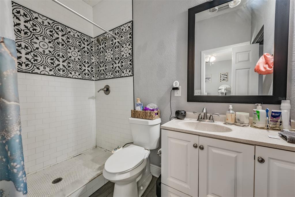 2334 West Spruce Street Tampa, FL 33607 - Photo 16 of 24 a bathroom with a sink a toilet and shower