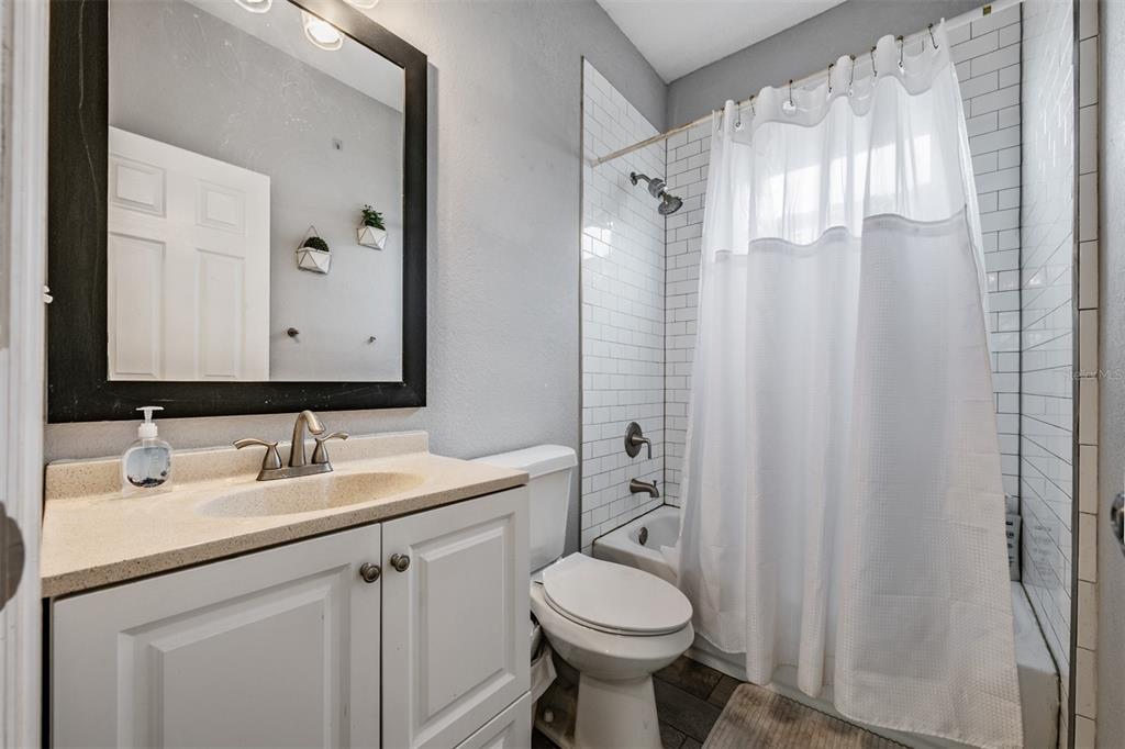2334 West Spruce Street Tampa, FL 33607 - Photo 18 of 24 a bathroom with a sink toilet and shower