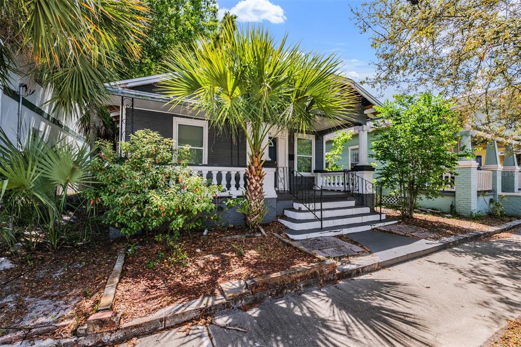 2334 West Spruce Street Tampa, FL 33607 - Photo 2 of 24 a front view of a house with garden