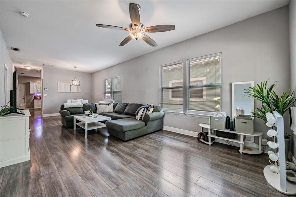 2334 West Spruce Street Tampa, FL 33607 - Photo 5 of 24 a living room with furniture and a wooden floor