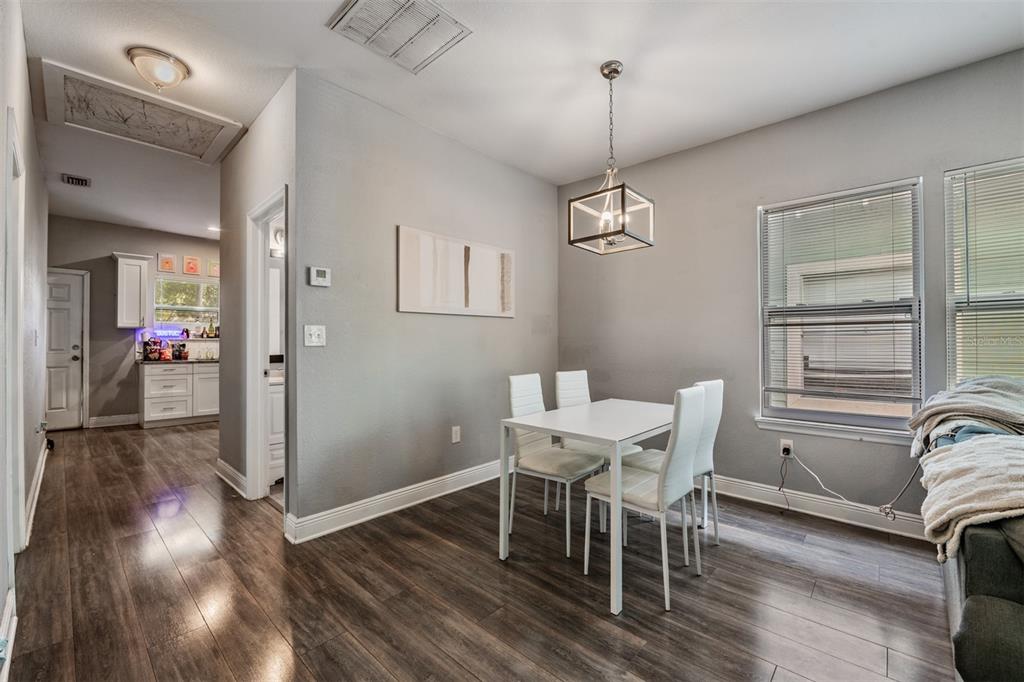 2334 West Spruce Street Tampa, FL 33607 - Photo 9 of 24 a view of a dining room with furniture window and wooden floor