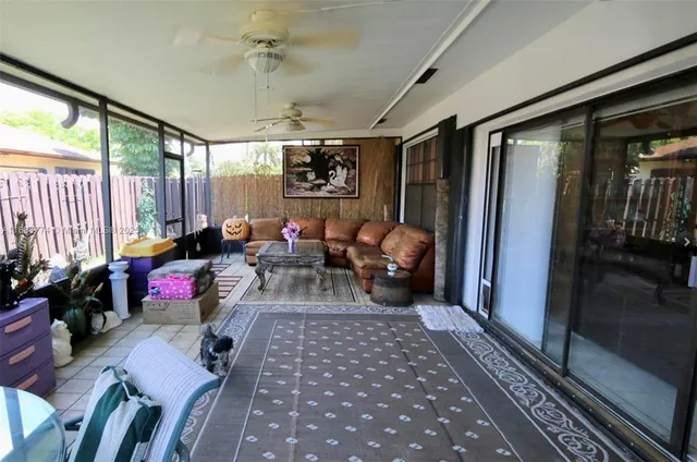 a living room with furniture or couch and a window