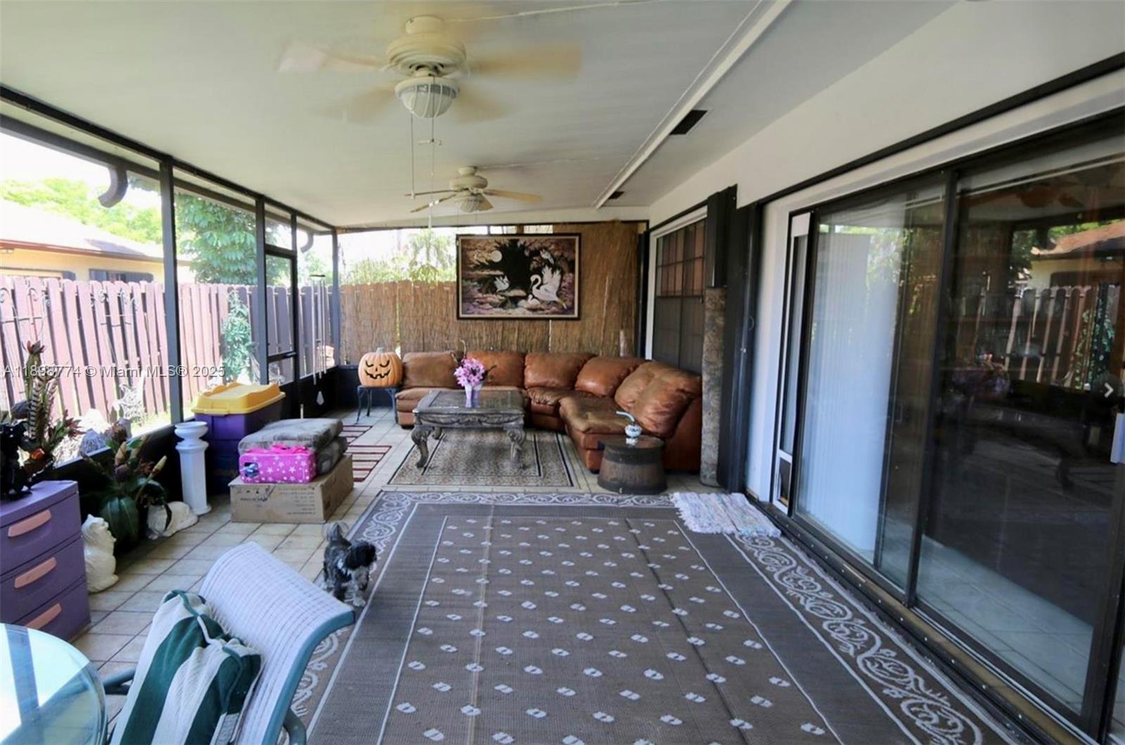7521 Southwest 26th Court, Unit 77 Davie, FL 33314 - Photo 12 of 13 a living room with furniture or couch and a window