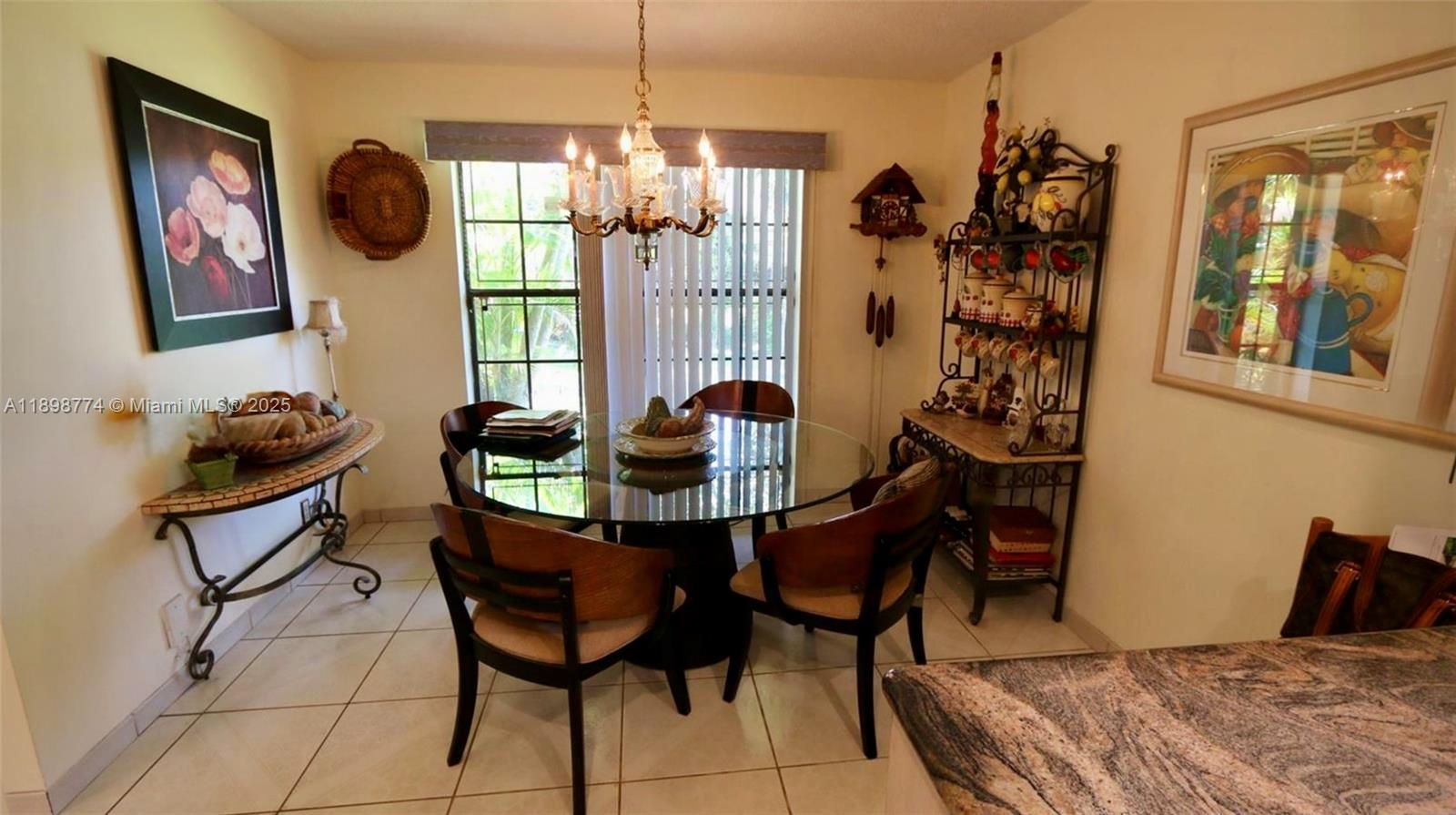 7521 Southwest 26th Court, Unit 77 Davie, FL 33314 - Photo 3 of 13 a dining room with furniture and window