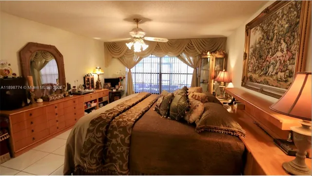 a bed room with a bed and a large mirror