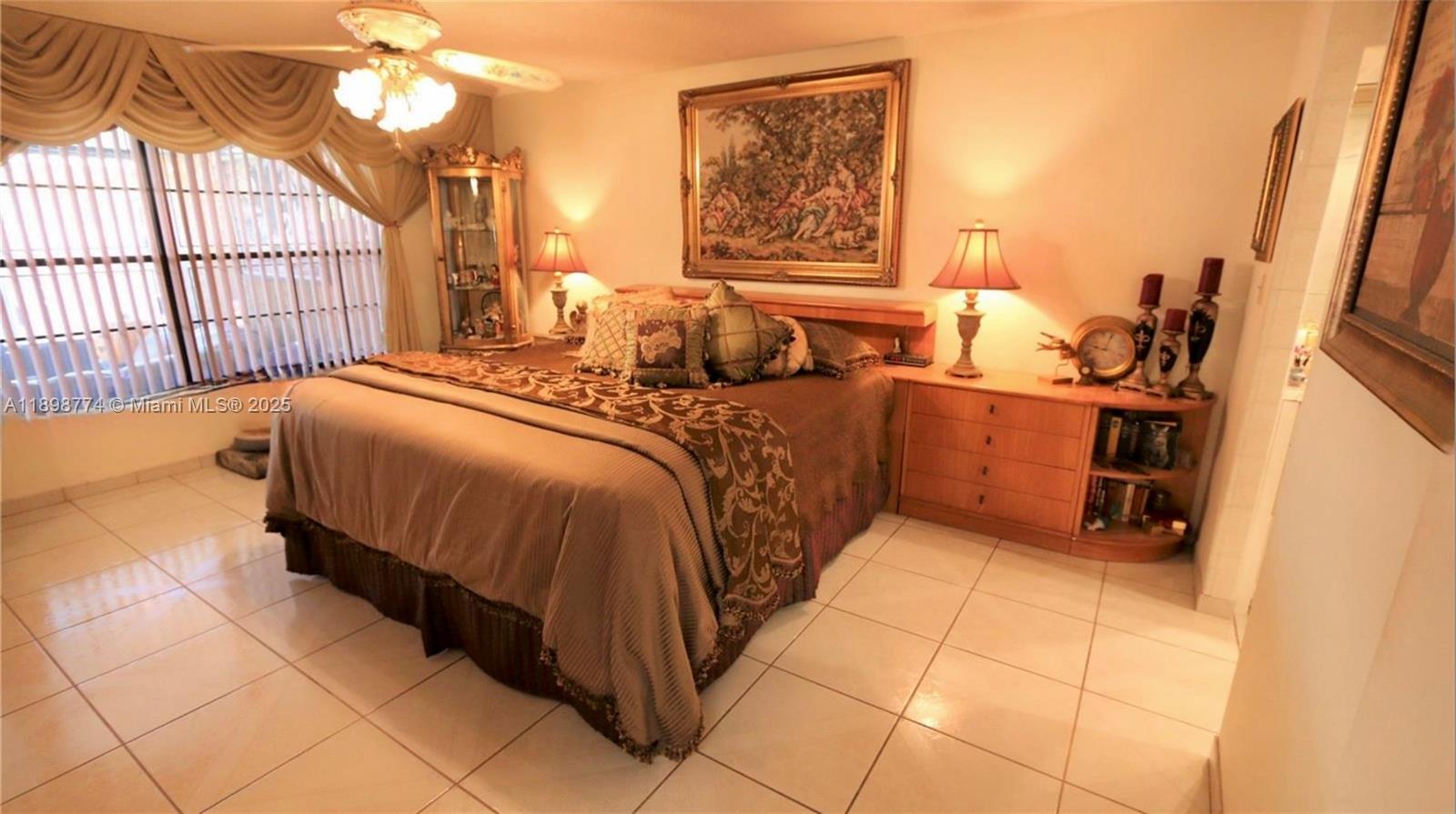 7521 Southwest 26th Court, Unit 77 Davie, FL 33314 - Photo 9 of 13 a bedroom with a bed and a window