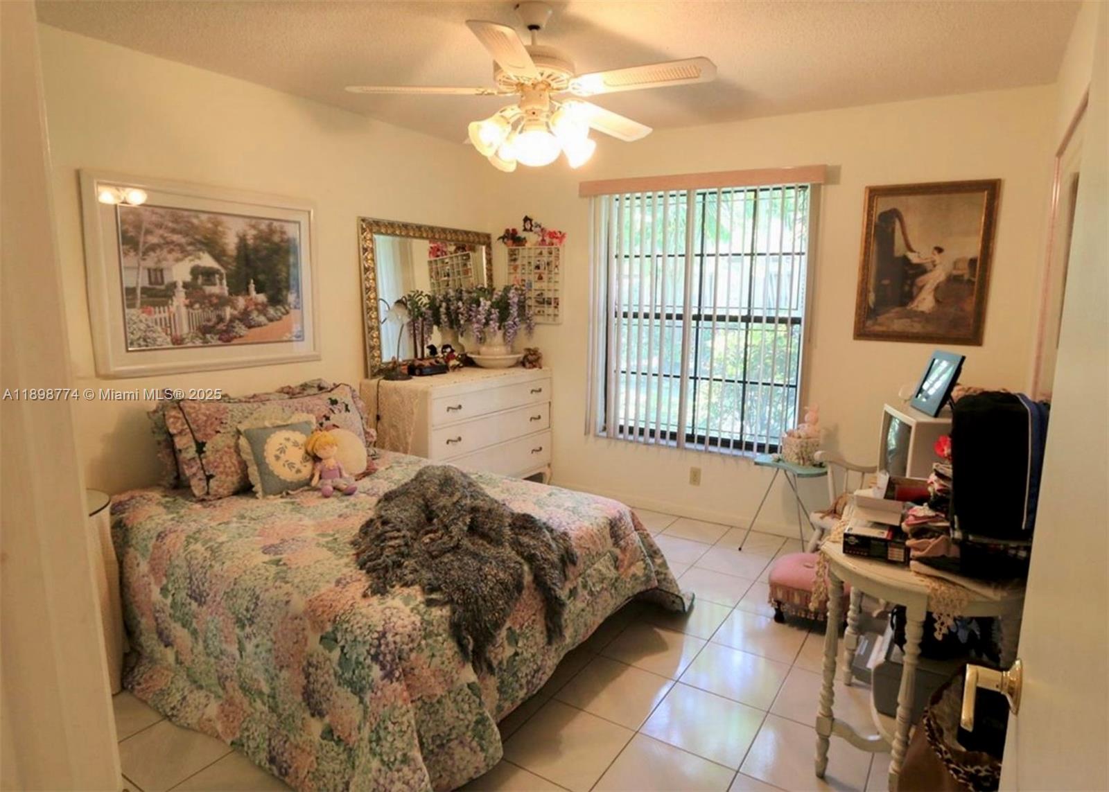 7521 Southwest 26th Court, Unit 77 Davie, FL 33314 - Photo 10 of 13 a bedroom with a bed and a window with chair