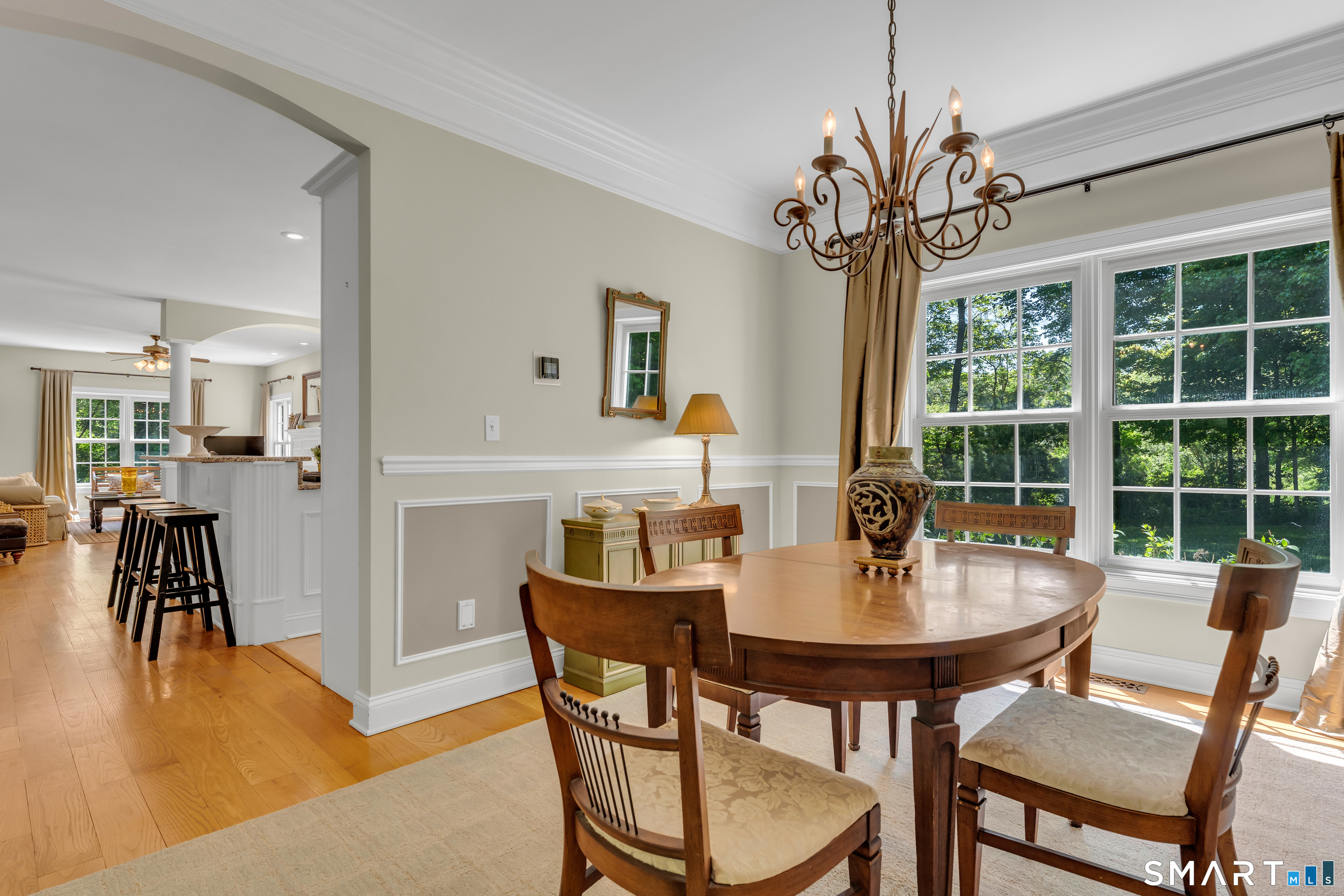 474 State Street Guilford, CT 06437 - Photo 11 of 40 a dining room with furniture potted plants and wooden floor