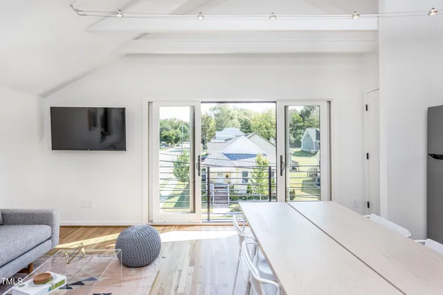 a bedroom with a bed and a television
