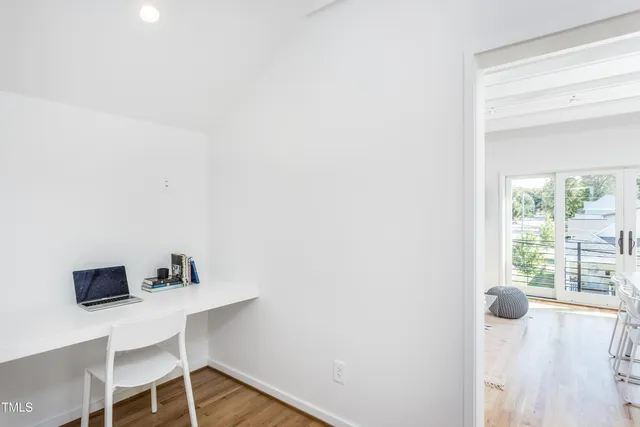 a workspace with furniture and window