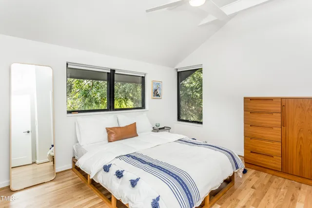 a bedroom with a bed and window