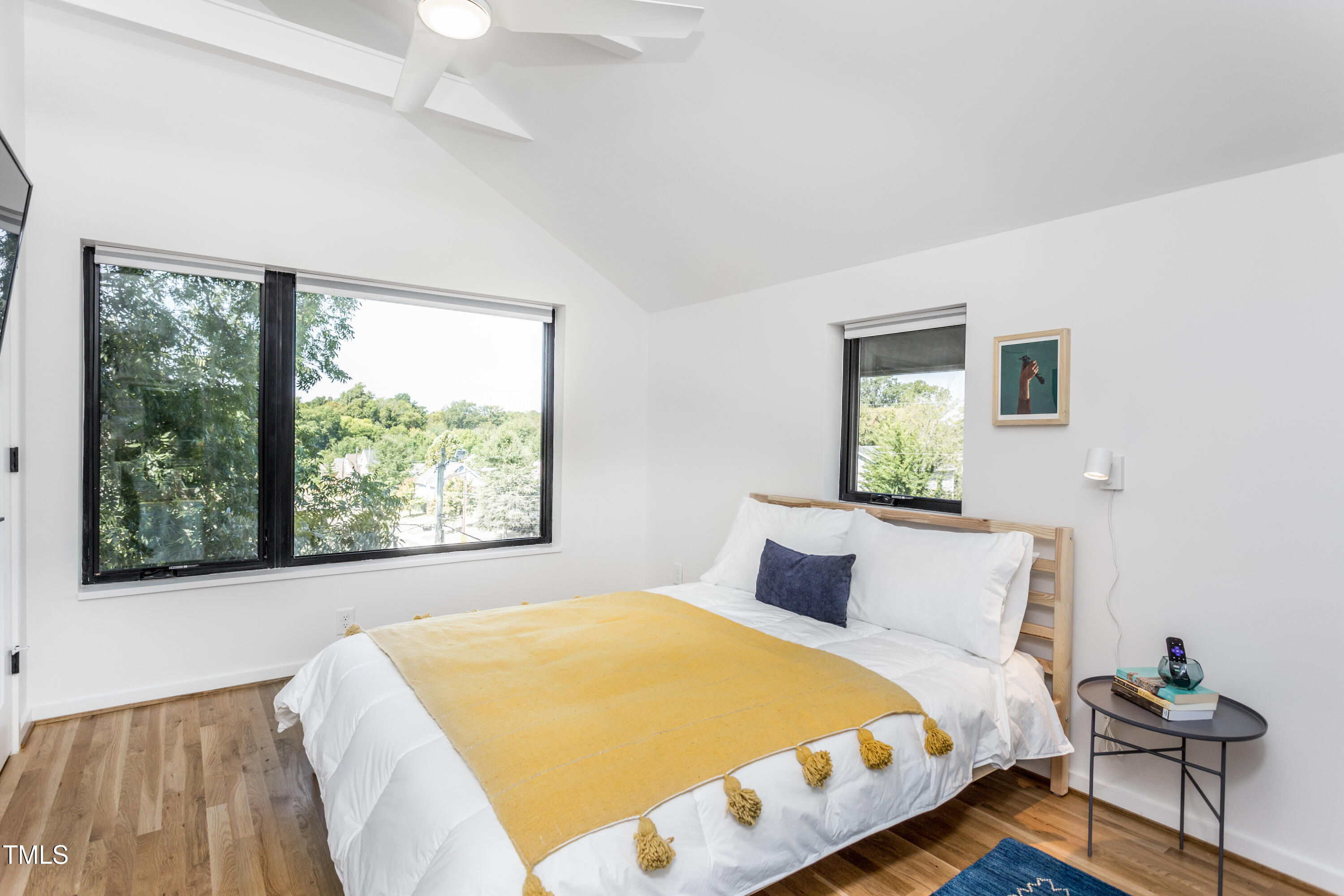 123 Idlewild Avenue, Unit 301 Raleigh, NC 27601 - Photo 19 of 20 a bedroom with a bed and window