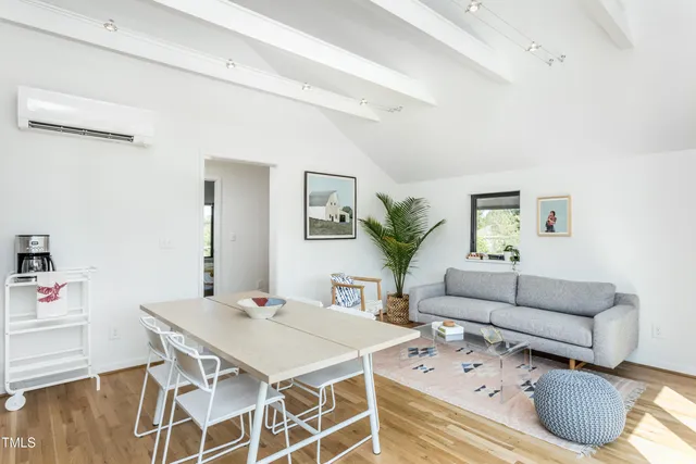 a living room with furniture and a table
