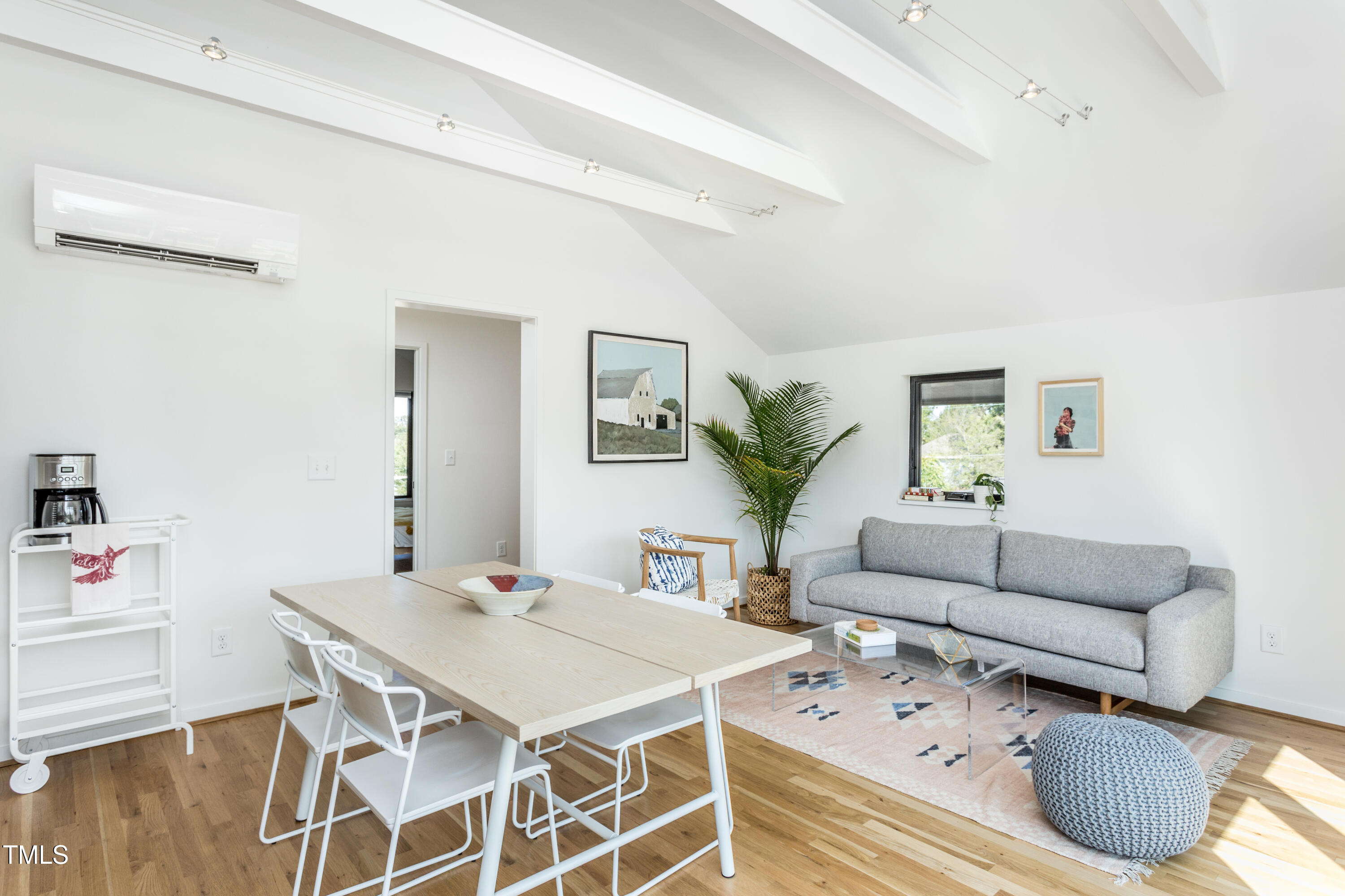 123 Idlewild Avenue, Unit 301 Raleigh, NC 27601 - Photo 7 of 20 a living room with furniture and a table