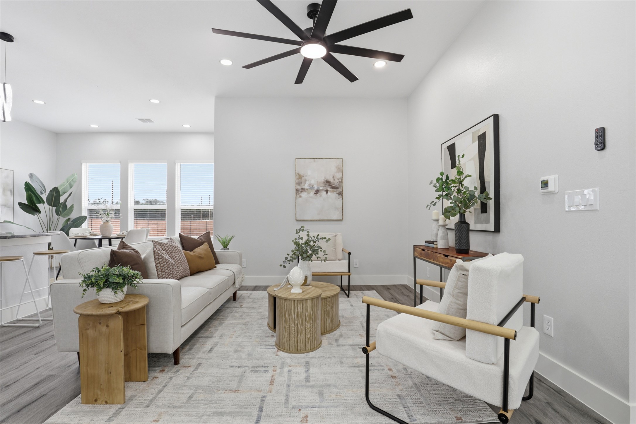 113 Los Robles Road Elgin, TX 78621 - Photo 2 of 20 Bright living area featuring wood-finish flooring, recessed lighting, and a modern ceiling fan