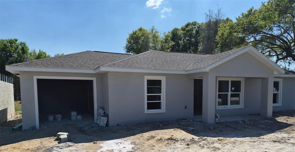 7640 Southwest 14th Street Ocala, FL 34474 - Photo 1 of 4 a view of a house with a yard