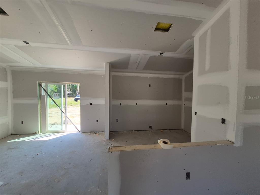 7640 Southwest 14th Street Ocala, FL 34474 - Photo 2 of 4 a view of a livingroom with an empty space and a window