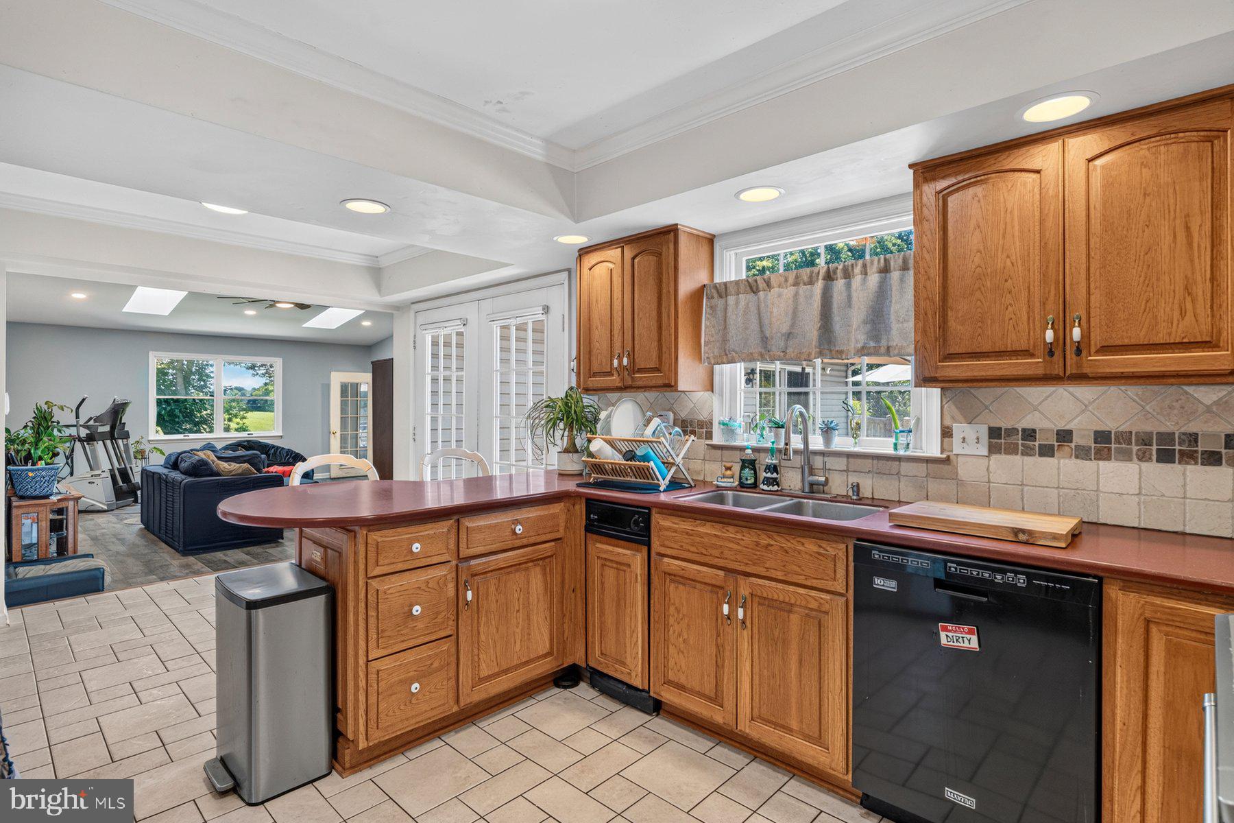 49 Rockland Road Westminster, MD 21158 - Photo 38 of 66 a kitchen with a sink dishwasher stove and cabinets