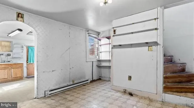 a view of a house with a small backyard