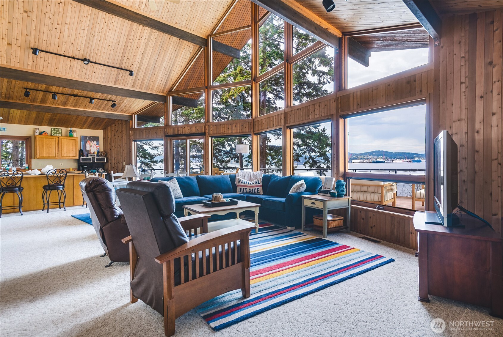 7616 Cypress Way Anacortes, WA 98221 - Photo 12 of 35 a living room with furniture a rug and a window