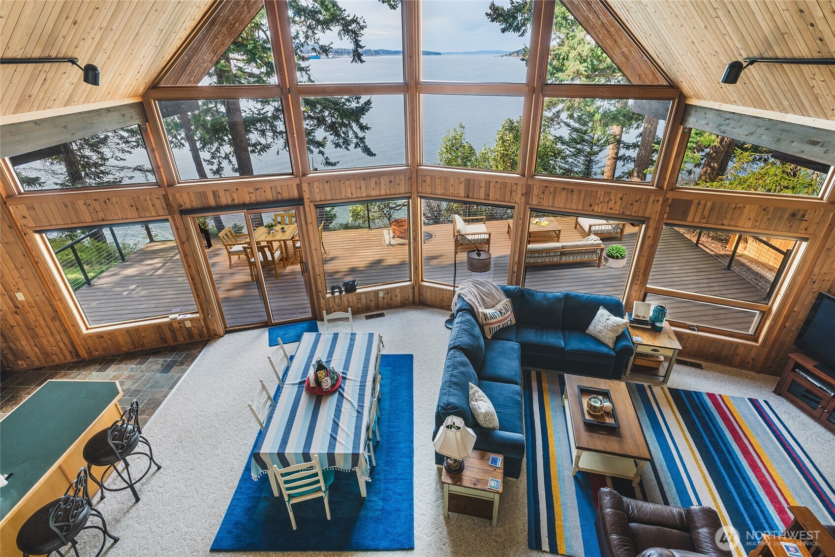 7616 Cypress Way Anacortes, WA 98221 - Photo 16 of 35 a view of living room with furniture and floor to ceiling windows