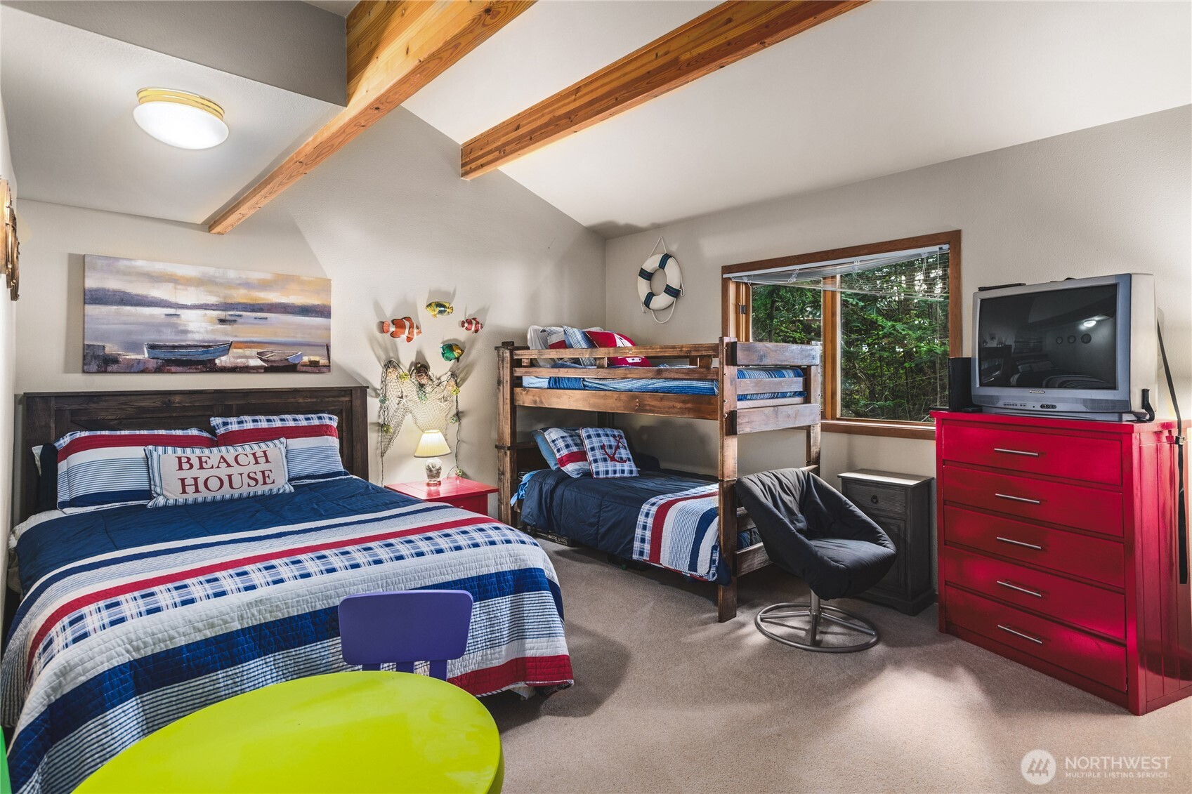 7616 Cypress Way Anacortes, WA 98221 - Photo 23 of 35 a bedroom with a bed and a flat tv screen
