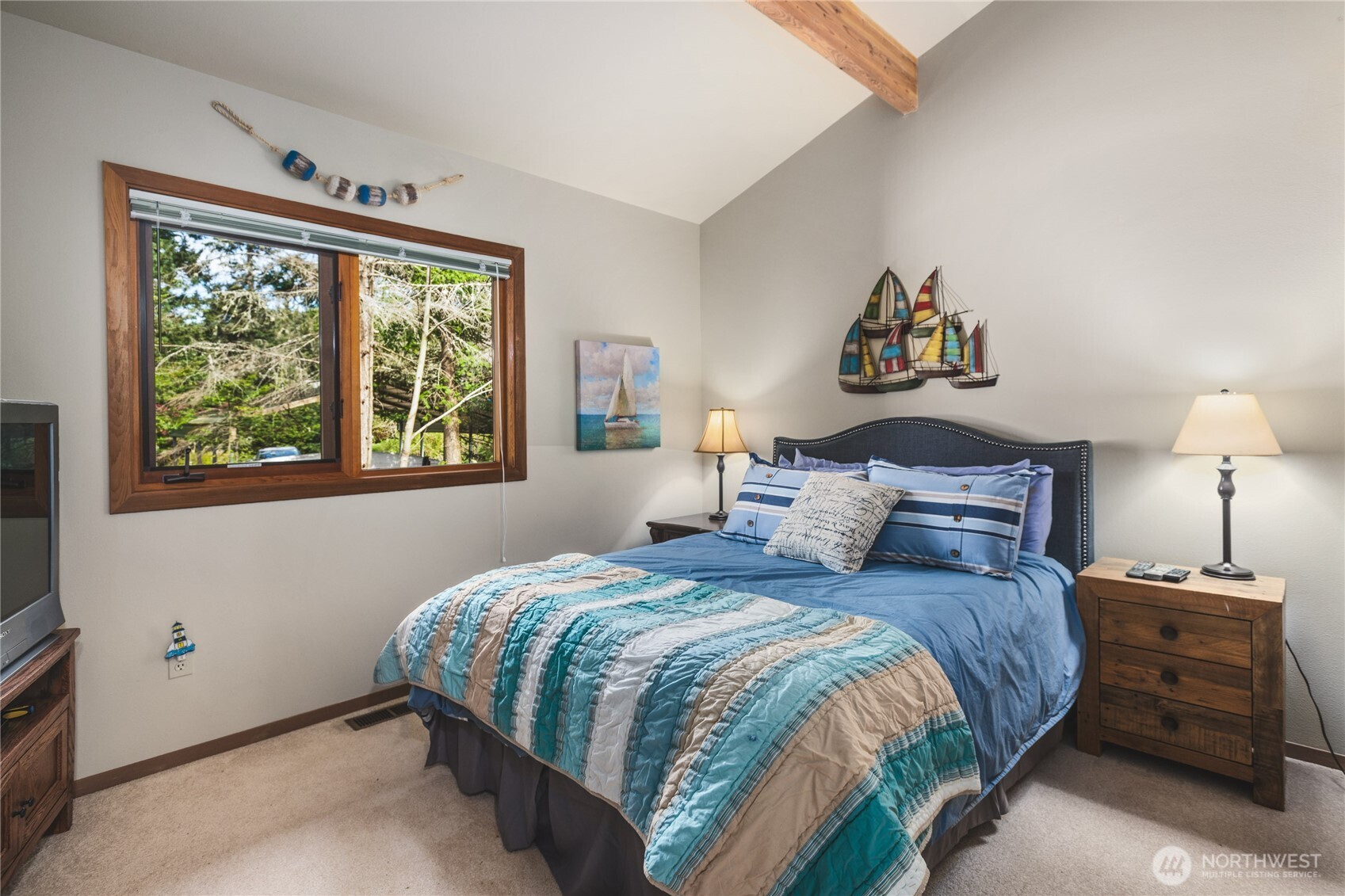 7616 Cypress Way Anacortes, WA 98221 - Photo 25 of 35 a bedroom with a bed and a window