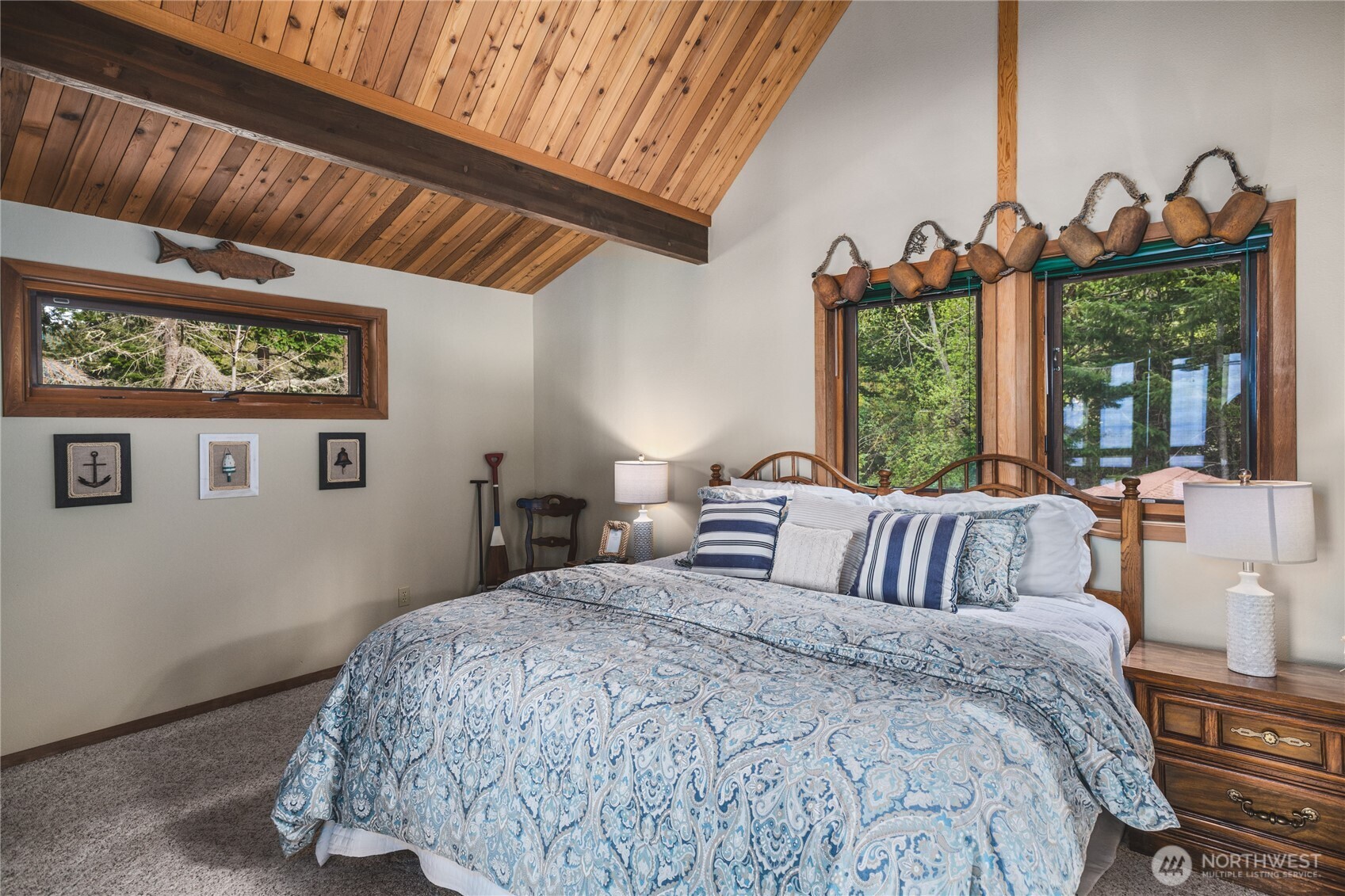 7616 Cypress Way Anacortes, WA 98221 - Photo 27 of 35 a bedroom with bed and a large window
