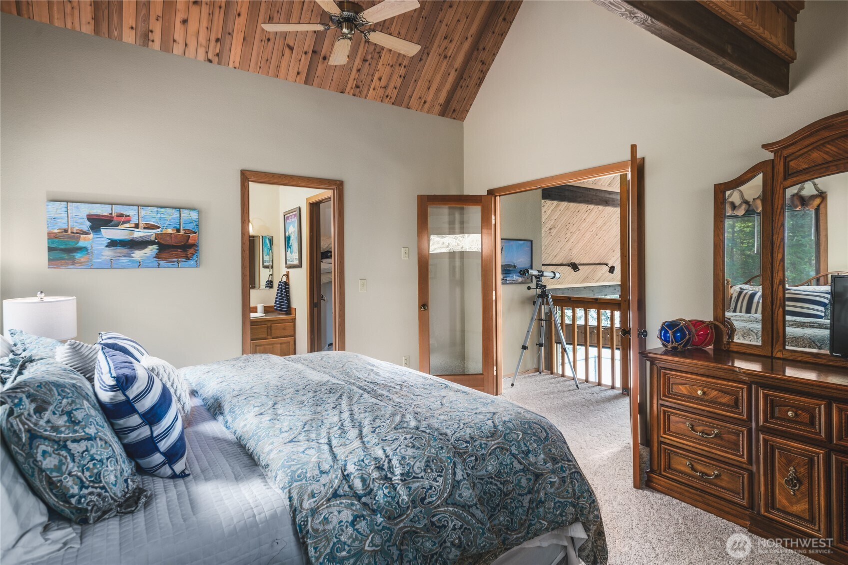 7616 Cypress Way Anacortes, WA 98221 - Photo 28 of 35 a bedroom with a bed dresser and a large window