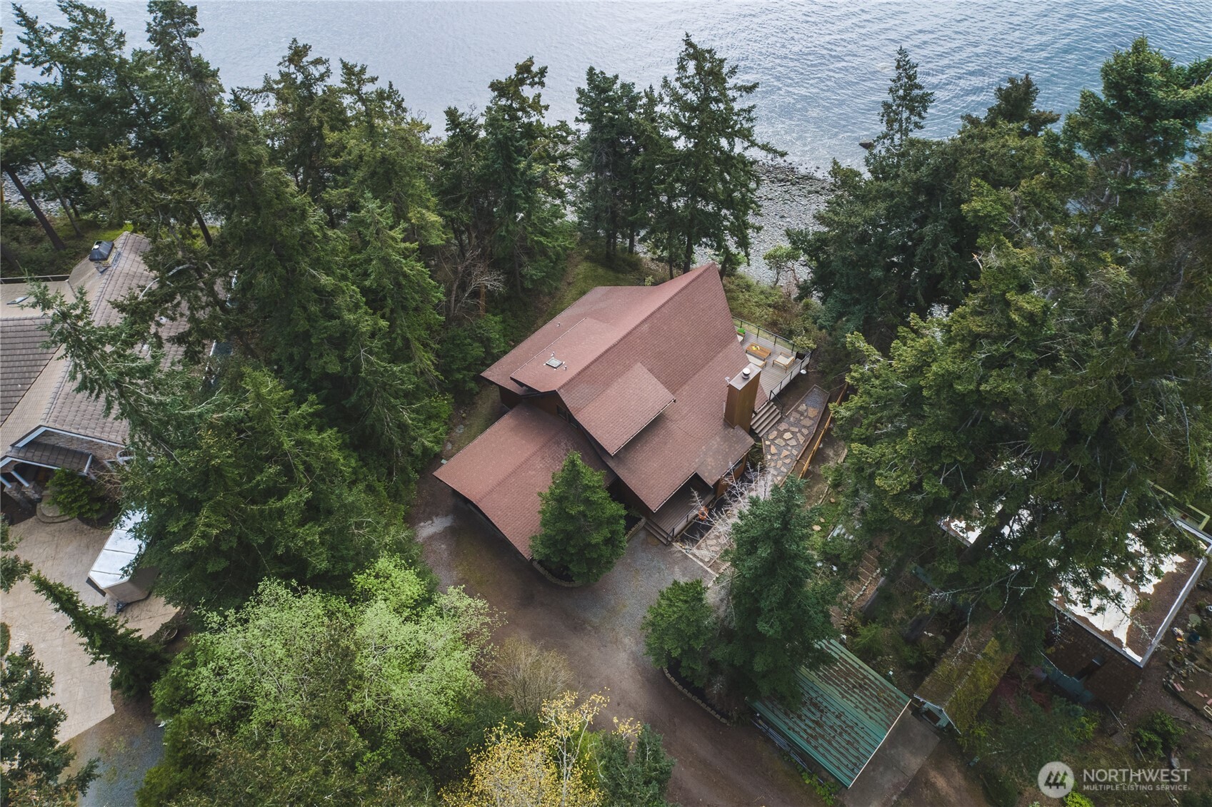 7616 Cypress Way Anacortes, WA 98221 - Photo 33 of 35 an aerial view of a house with yard and outdoor seating
