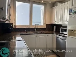 a kitchen with a sink and a stove