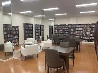 a view of living room with furniture and a view of kitchen