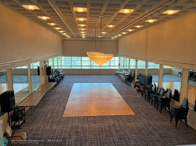 a view of an empty room with windows