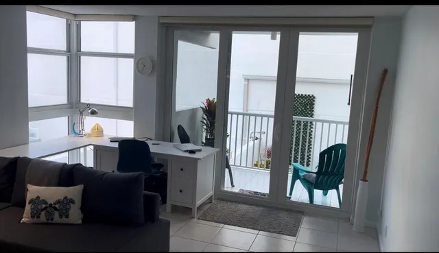 a view of a entryway with flower pots