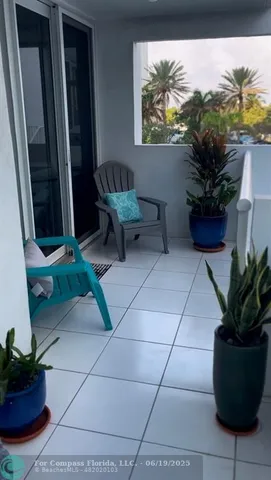 a view of a entryway with flower pots