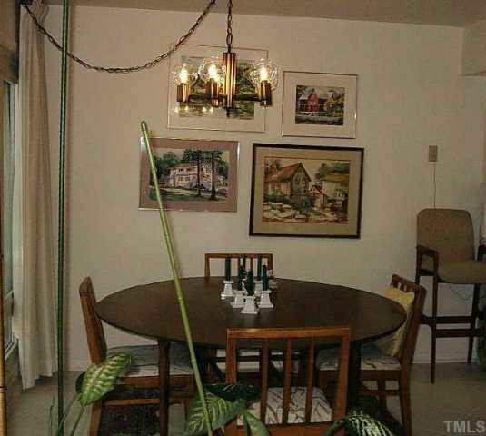 1786 Quail Ridge Road Raleigh, NC 27609 - Photo 4 of 10 a view of a dining room with furniture and wooden floor