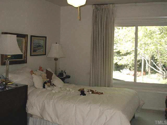 1786 Quail Ridge Road Raleigh, NC 27609 - Photo 10 of 10 a bedroom with a bed and a window