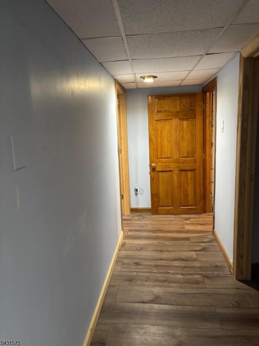 358 Woodland Road, Unit 2 Madison, NJ 07940 - Photo 42 of 50 a view of an empty room with wooden floor and a window